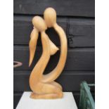 A wooden lovers sculpture 23"H