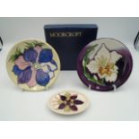 2 Moorcroft pottery pin trays - one with purple and pink anenome on a cream background, impressed