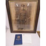 A photo of a soldier along with Northamptonshire regiment 7th battalion book and a letter sent