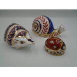 Royal Crown Derby Hedgehog paperweight gold stopper, Ladybird seven spot with gold stopper and snail