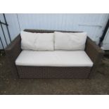 A Rattan garden sofa in good clean condition