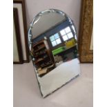 A decorative vanity mirror with stand