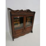 An oak smokers cabinet 77x46x26cm