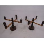 A pair of wooden candle holders