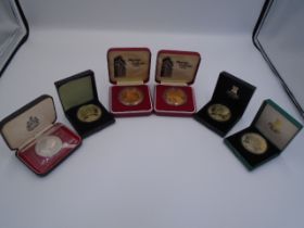 6 boxed medallions - 2 x museum galleries and 4 x Isle of Man