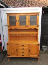 Dresser with 3 obscure glass doors to top and 4 central drawers to base flanked by cupboard doors