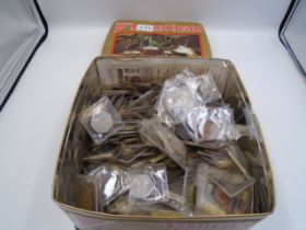 Assorted coins in a cream biscuit tin - a mix of 50% British 'silver' and 50% copper with a few