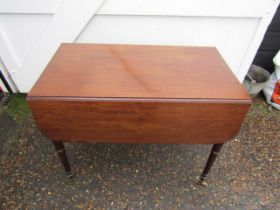 Mahogany Pembroke table with drawer each end and brass castors