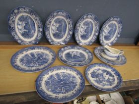 Blue and white platters and sauce boat