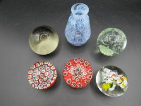 5 paperweights and a vase by Caithness
