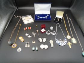 A collection of costume jewellery, some sets and a 925 boxed silver necklace, a rolled gold crucifix