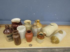 Stoneware flagons, foot warmers and pots etc