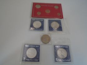 5 medallions Falklands/Task force sleeved (Pobjoy) and a sleeved Falkland Islands coin set.