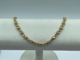 18 carat gold diamond set tennis bracelet, approx 19cm long, gross weight 19.4g, boxed