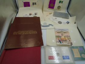 A small collcetion of coins/stamps and 1st day covers etc..