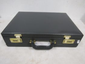 A briefcase with code lock (provided)