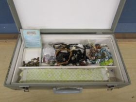 Vintage case containing costume jewellery and buttons etc