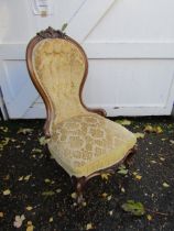 Upholstered mahogany framed bedroom chair on castors