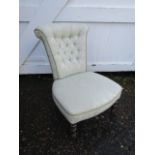 Upholstered bedroom chair on castors