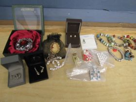 A collection of jewellery inc some silver and charm bracelets