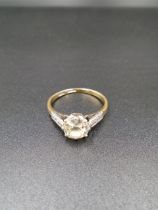 18ct Gold platinum set 1.5ct round cut Diamond ring with small stone set in platinum shoulders, 3.