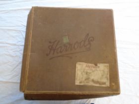 A collection of vintage hand made clothes 1920/30's, stored in a vintage 1932 'Harrods' hat box