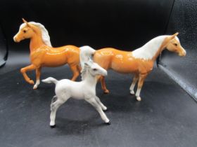 Royal Doulton prancing palomino, Beswick foal (model no. 836) and Beswick Arab palomino Xayal (model