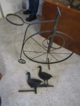 A penny farthing plant stand and duck decor