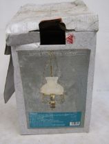 An 'oil lamp' style ceiling light in original box