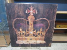 A large print of a crown on board 87x87cm