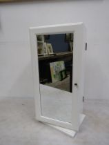 A rotating vanity/jewellery cabinet, like new with mirror both sides. 52cmH