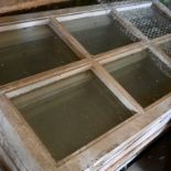 Large collection of wooden windows unused