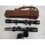2 German rifle scopes one in leather case