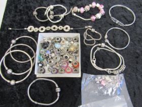 A quantity of charm bracelets and charms, many stamped 925