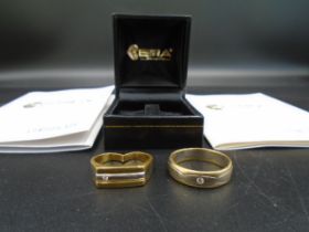 2, 18ct Cypriot yellow and white gold rings, both set with a diamond. Size W, One has been cut. Both