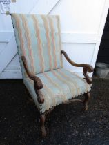 An antique open armed chair