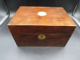 A wooden sewing box with brass escutcheon and inlay