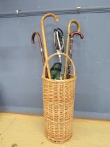 Wicker stick stand with walking sticks and shooting stick etc