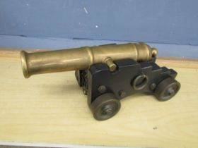 Heavy brass and wooden ornamental cannon in box. L40cm approx