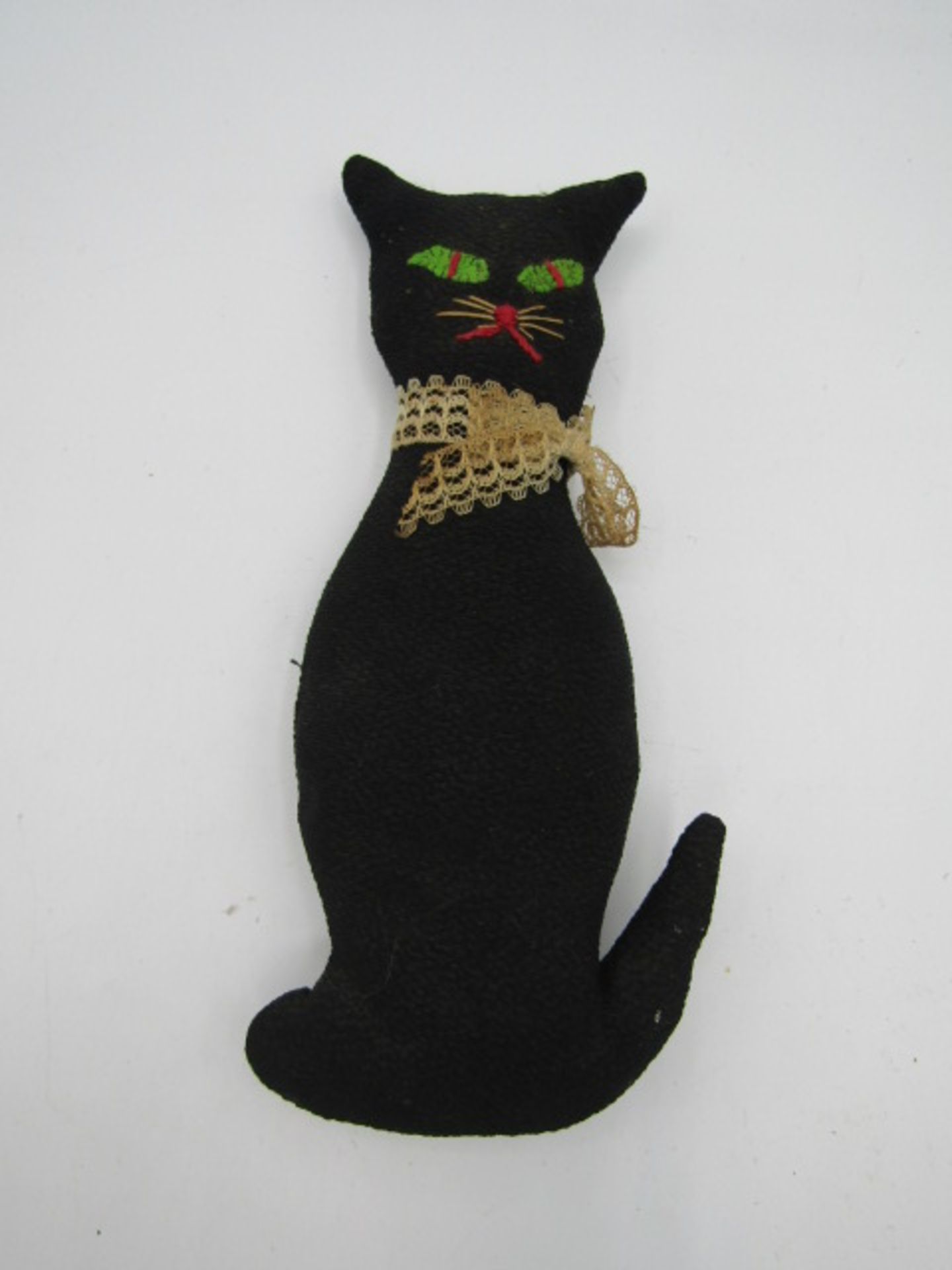 An antique hand made witches cat (believed to be 104 yrs old and the witches lucky black cat)