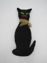 An antique hand made witches cat (believed to be 104 yrs old and the witches lucky black cat)