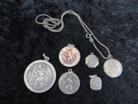 5 silver St Christopher pendants hallmarked or stamped silver/925 plus one white metal 35 gms