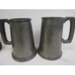 2 pewter tankards with engravings and glass bottoms