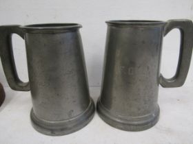 2 pewter tankards with engravings and glass bottoms