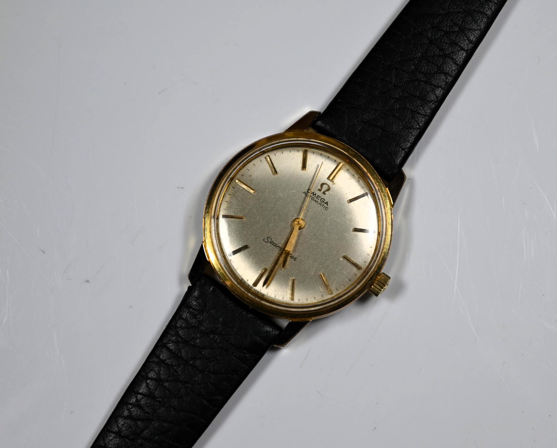 Omega Seamaster Automatic gentleman's gold wristwatch the champagne dial with raised gold baton