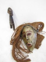A tribal mask with hair and a carved African figure (old)
