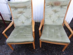 A pair of upholstered parker knoll chairs