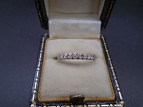 A 9ct gold ring set with 9 diamonds size M, 1.3g gross weight.