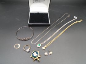 A box of costume jewellery to include - a ring, brooch and necklaces and a pair of silver (925)