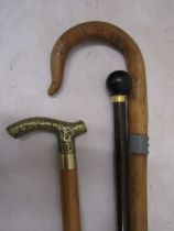 Brass topped decanter walking cane and 2 others